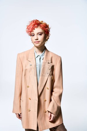 A woman with red hair donning a tan coat.