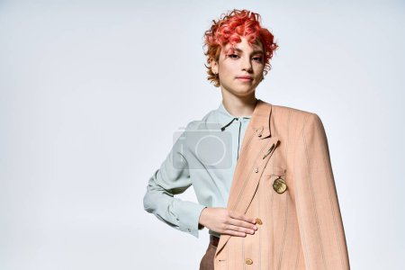 A stylish woman with red hair dons a vibrant jacket.
