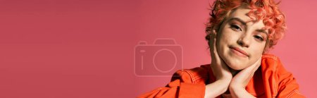 Photo for A vibrant woman dressed in an orange shirt up close. - Royalty Free Image