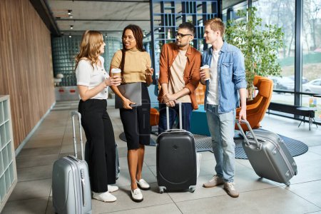 A diverse group of colleagues in casual attire standing together with luggage in a hotel lobby during a corporate trip.