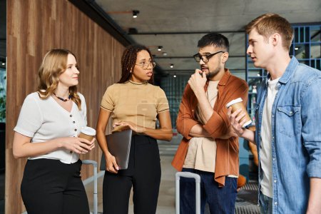 Photo for Multicultural colleagues in casual clothes stand in a circle, engaging in conversation and team bonding during a corporate trip. - Royalty Free Image