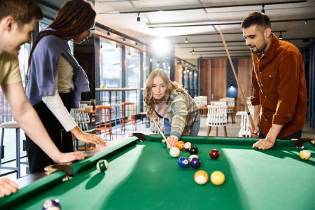 A group of coworkers enjoy a game of pool, strategizing and bonding in a modern office setting.