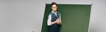 Photo for Beautiful female student in uniform in front. - Royalty Free Image