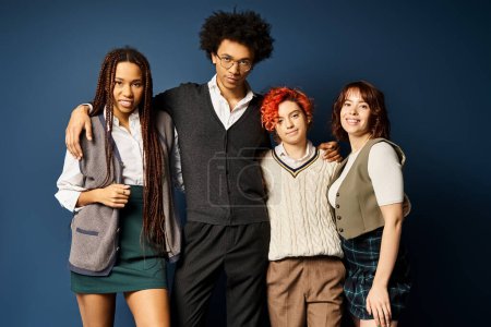 Photo for Multicultural friends, including nonbinary person, stand together in stylish attire on dark blue background. - Royalty Free Image