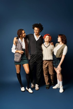 A diverse group of young friends, stand together in stylish attire against a dark blue background.