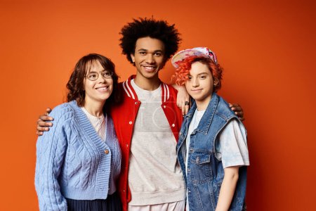 A diverse group of young friends, including a nonbinary person, standing together in stylish attire in a studio setting.