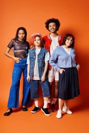 Young multicultural friends, including a nonbinary person, standing together in stylish attire in a studio setting.