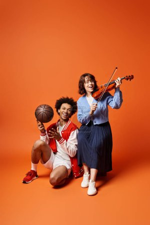 Young multicultural friends pose with a basketball and a violin in a stylish studio setting.