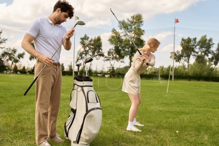 A man and woman in elegant attire enjoy a round of golf on a lush green field, showcasing grace and skill.