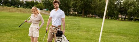 Photo for A young couple in elegant attire stands together on a golf course, embracing the upper-class lifestyle of old money. - Royalty Free Image