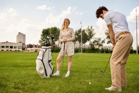 A man and woman dressed elegantly enjoy a round of golf on a lush green field, embodying an upscale lifestyle.