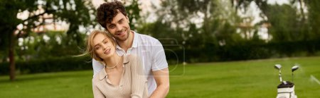 Stylish couple posing on lush park lawn, exuding timeless elegance and old money charm.