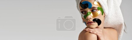 Photo for A woman with eye patches on her face, showcasing creativity and artistry in her makeup. - Royalty Free Image