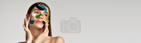 Photo for Artistic woman with eye patches on her face and hands showcasing unique expression and creativity through her captivating appearance. - Royalty Free Image