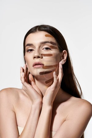Attractive young woman showcasing beauty products like foundation.