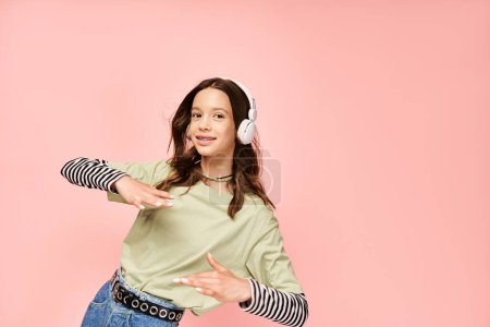 A stylish teenage girl in a green shirt listens intently to music through headphones, exuding a vibrant and captivating aura.