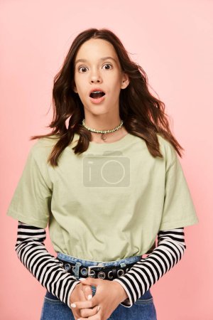 A stylish teenage girl with vibrant attire looks surprised.