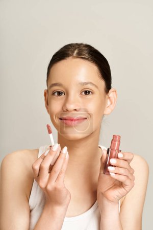 Une adolescente élégante tient deux rouges à lèvres dans ses mains, mettant en valeur sa personnalité vibrante et son amour pour le maquillage.