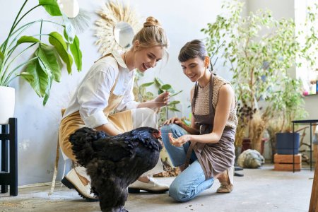 Lesbian couple lovingly petting a chicken at an art studio.