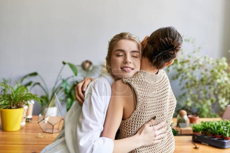 Affectionate moment; two women hugging on chair.