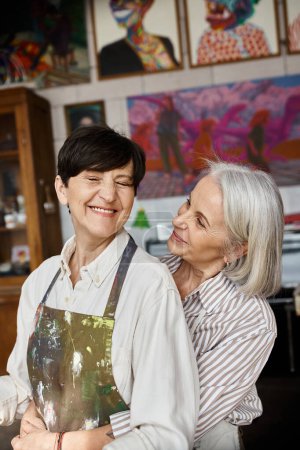 Photo for Two women collaborating in art studio. - Royalty Free Image