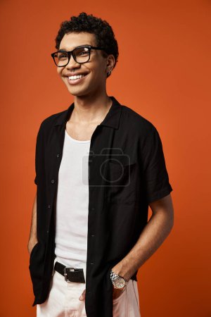Photo for Handsome African American man posing confidently in white shorts and stylish sunglasses. - Royalty Free Image