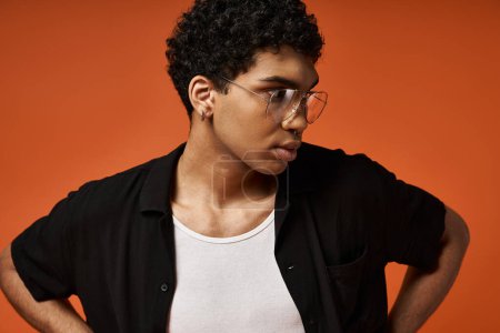 Handsome African American man wearing glasses and black shirt.