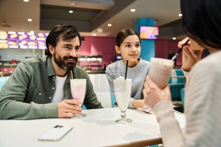 Une famille heureuse profitant de moments de qualité ensemble dans un restaurant moderne, se liant autour de boissons et de conversations animées.