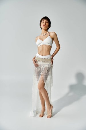 Foto de Elegant woman posing in stylish white bikini - Imagen libre de derechos