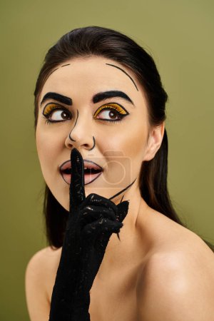 A stunning brunette woman with pop art makeup dons black gloves and a fake nose for a unique and intriguing look.