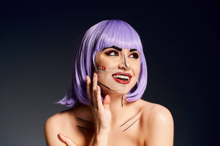 A charismatic woman with vibrant purple hair and bold pop art makeup strikes a pose against a black backdrop.