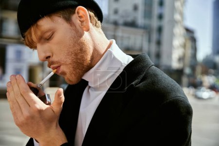 A young, stylishly dressed man with red hair smoking a cigarette on a city street.