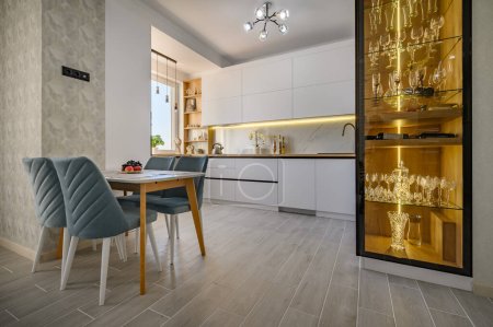 Photo for Modern and stylish white studio apartment with fully functional kitchen - Royalty Free Image