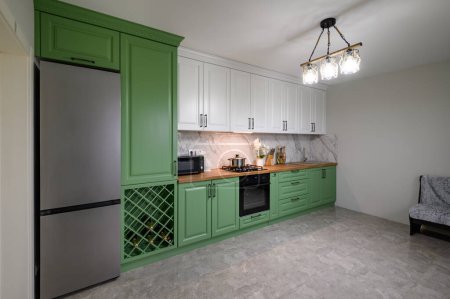 New green modern well designed kitchen interior after renovation