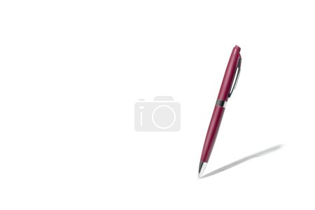 Photo for Detailed red classic ballpoint pen writing on white surface with its shadow. Isolated on white background with clipping path - Royalty Free Image