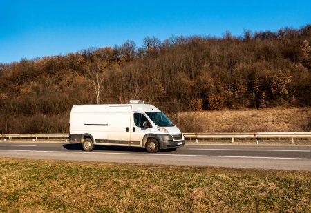 White cargo van at the open highway