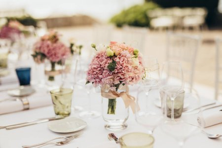 Photo for Wedding table decoration with flowers - Royalty Free Image