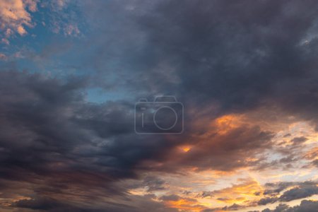 Cloudscape at sunrise. Sky view in the morning with dramatic clouds. Nature background photo.
