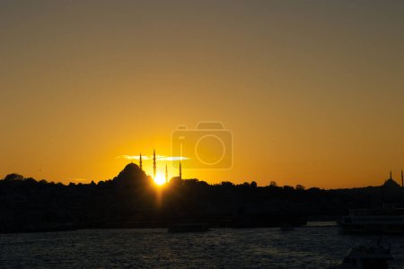 Photo for Istanbul skyline at sunset. Suleymaniye Mosque and sunlight beams. Islamic or ramadan background photo. - Royalty Free Image