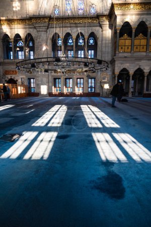 Photo for Shadows of the windows on the carpet in Nuruosmaniye Mosque. Islamic background vertical photo. Istanbul Turkiye - 12.23.2022 - Royalty Free Image