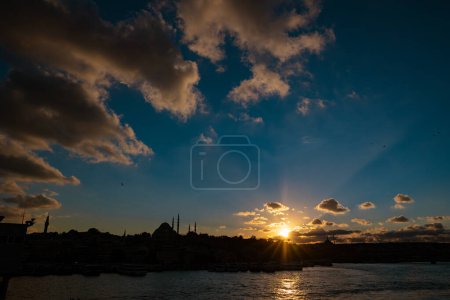 Photo for Istanbul view at sunset with silhouette of mosques and dramatic clouds. Travel to Istanbul background photo. Ramadan or islamic concept photo. - Royalty Free Image