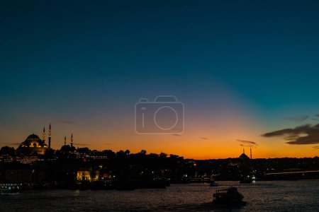 Photo for Istanbul view at sunset with orange and blue sky. Islamic concept photo. Golden Horn and mosques. - Royalty Free Image