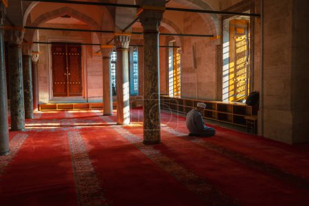 Photo for Ramadan or islamic background photo. Muslim man praying in the mosque. Suleymaniye Mosque and muslim man. Kandil or kadir gecesi or laylat al-qadr concept. Istanbul Turkiye - 12.31.2022 - Royalty Free Image