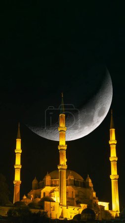 Selimiye Mosque and crescent moon. Islamic or ramadan background photo. Ramadan or kadir gecesi or laylat al-qadr concept vertical story photo.