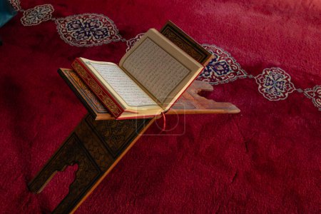 Photo for Islamic photo. The Holy Quran on the lectern in a mosque. Ramadan or islamic or kadir gecesi or laylat al-qadr concept photo. Istanbul Turkiye - 1.18.2023 - Royalty Free Image