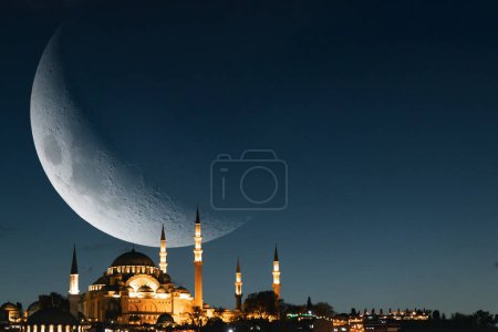 Islamic background photo. Crescent moon and Suleymaniye Mosque with copy space for text. Ramadan or laylat al-qadr or kadir gecesi background photo.