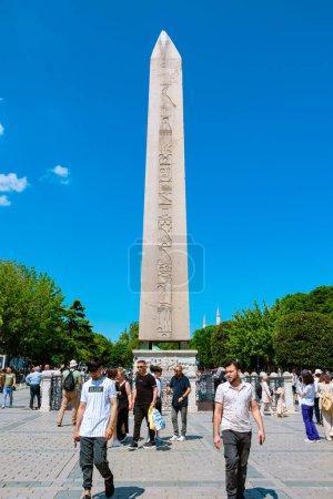 Photo for Obelisk of Theodisus in Sultanahmet Square with tourists vertical photo. Travel to Istanbul background photo. Istanbul Turkiye - 6.30.2023 - Royalty Free Image