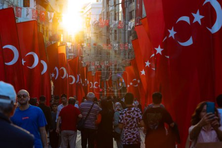 Photo for National holidays of Turkiye concept photo. Turkish flags in Istiklal Caddesi or Istiklal Avenue with people. Istanbul Turkiye - 10.28.2023 - Royalty Free Image