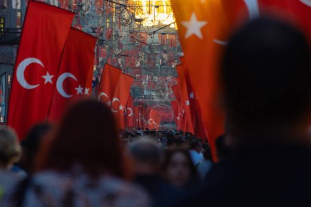 Photo for Turkish flags and crowded people in Istiklal Avenue at sunset. National holidays of Turkiye concept photo. Istanbul Turkiye - 10.28.2023 - Royalty Free Image