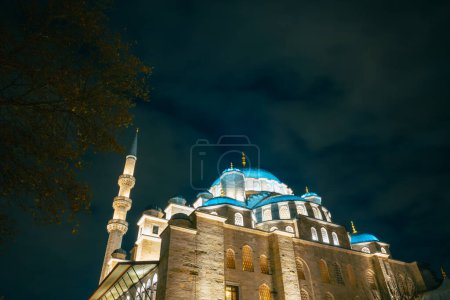 Photo for Eminonu Yeni Cami or New Mosque view at night. Islamic concept photo. Ramadan or laylat al-qadr or kadir gecesi background. - Royalty Free Image